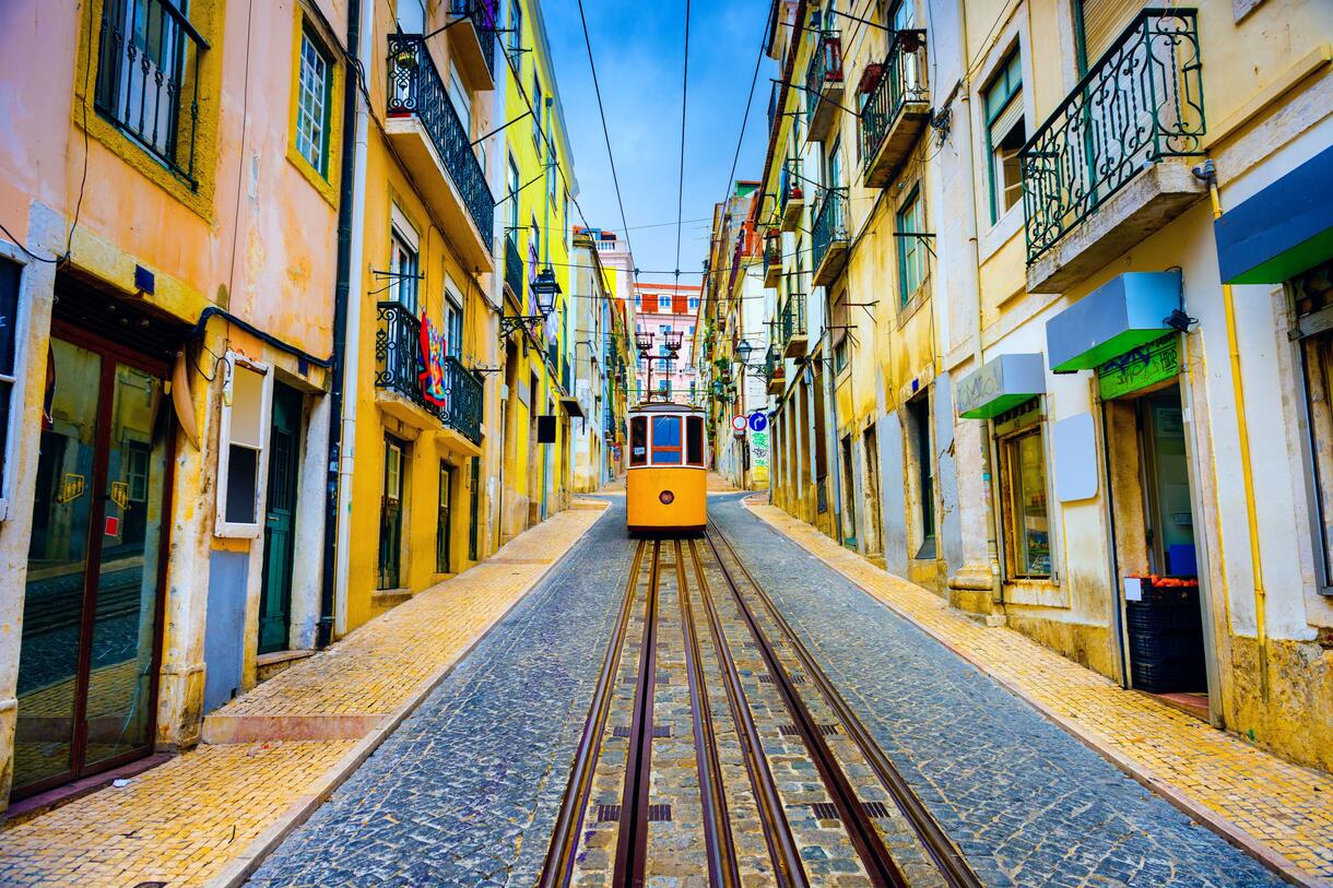 Colourful tiled buildings and a tram in Lisbon